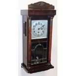A 1920s mahogany cased wall clock, the rectangular silvered colour dial, key wind with blue han