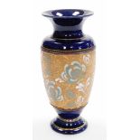 A Royal Doulton Lambeth Stoneware vase, with dark blue painted ground, and banded blue flower decora