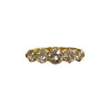 A Victorian diamond five stone dress ring, set with five round brilliant cut diamonds, the central s