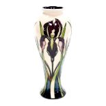 A Moorcroft bud vase, Antheia pattern, decorated with purple reeds and flowers, signed to underside