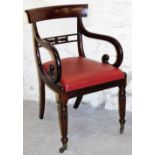 A 19thC mahogany carver chair, with carved frieze on red faux leather seat, on tapered legs.