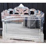 A modern rectangular mirrored glass mirror, with arched applied mirror top and pleated decoration, 8