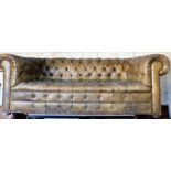 A green buttoned and studded leather Chesterfield sofa, 200cm wide.