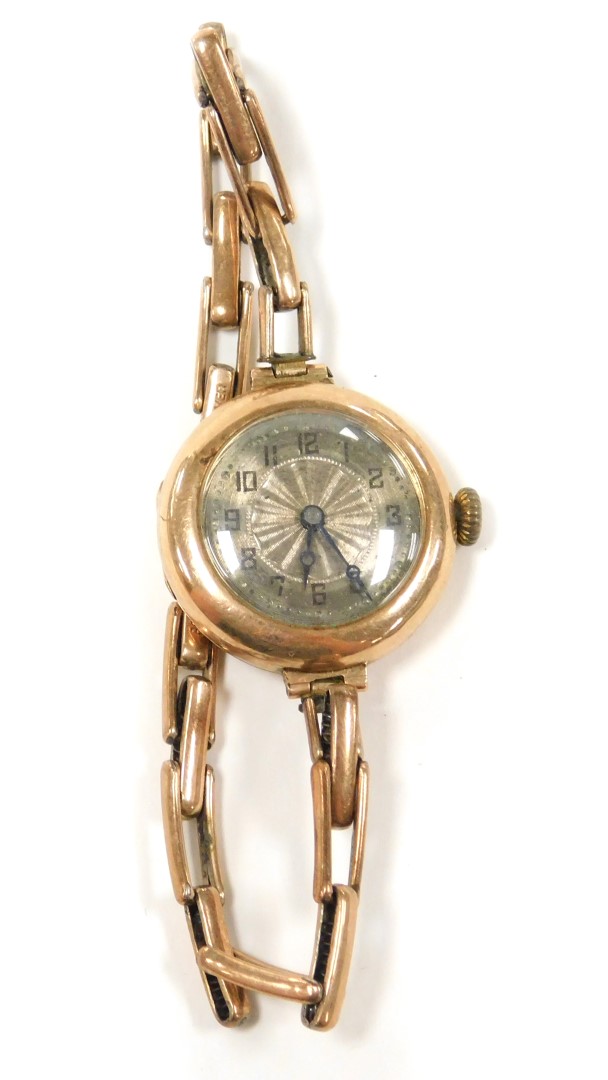 A wristwatch, with small circular silvered coloured dial in a yellow metal case, marked 375, on an e - Image 2 of 2