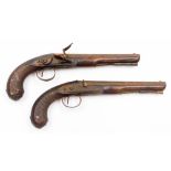 A pair or brace of signed early 19thC officers' overcoat pistols by Robert Wogdon, both of unusually