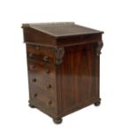 A William IV rosewood Davenport, with baluster gilt metal gallery, the slope revealing drawers and r