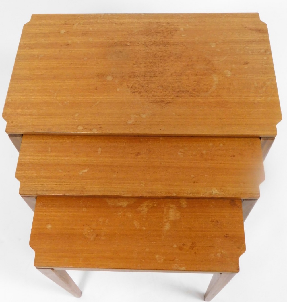 A nest of vintage teak tables circa 1960s, rectangular topped, on square tapering legs, the largest - Image 2 of 2