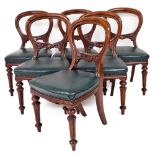 A set of six Victorian mahogany balloon back dining chairs, with green leather overstuffed and studd