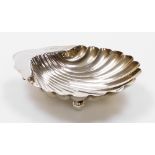 An Edward VII silver shell scallop dish, on three bun feet with hallmarks to border, Sheffield 1907