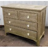 An Eastern style chest of drawers, with inset silver coloured panels, heavily embossed with flowers,