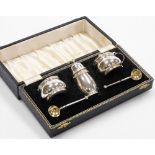 A five piece cased condiment set, principally Elizabeth II comprising pepper pot 8cm high, mustard p