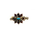 A Victorian dress ring, the centre set with garnets, seed pearls and a turquoise, on V splayed shoul