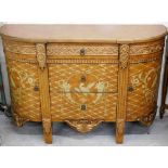 A French style sideboard, with a painted gilt and wood type finish, above three drawer centre