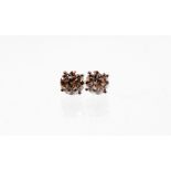 A pair of 18ct gold diamond solitaire studs, each diamond in four claw setting, round brilliant cut