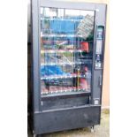 A Polyvend vending machine, with six rows of nine vending slots, and a long bar grab section, 185cm