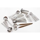 A suite of Viners stainless steel studio cutlery, matching soup spoons, dessert spoons, forks, servi