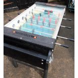 A FAS table football machine, with balls, base, and brackets, 97cm high, 170cm deep, 117cm wide. Not