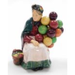 A Royal Doulton Old Balloon Seller figure, numbered HN1315, with applied velvet bottom, 19.5cm high.