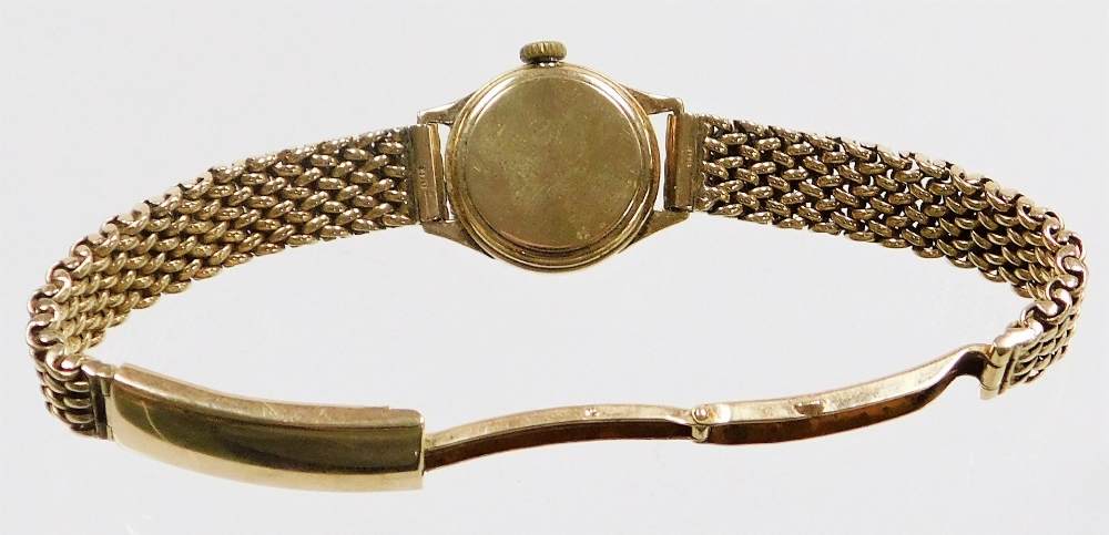 An Omega 9ct gold ladies wristwatch, with small circular silvered dial, 1.2cm diameter, on a four ro - Image 3 of 3