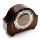 A Pleasance & Harper Ltd of Oxford Art Deco style oak cased mantel clock, with a scroll carve base a