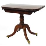 A 19thC mahogany card table, with top opening to reveal green lined interior, on four splayed legs,