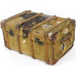 An early 20thC pressed wooden bound travel trunk, with various labels to include Epsom, Hull, etc.,