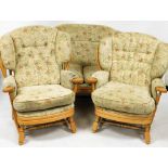 An Ercol style Cottage Garden suite, comprising two seater sofa and two matching armchairs.