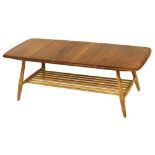 A light elm Ercol style rectangular coffee table, with magazine rack below, 35cm high, 107cm wide, 4