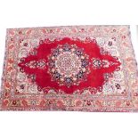 A vintage multicoloured Persian Tabriz rug, 280cm x 189cm.