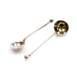 A pair of Victorian silver salt spoons, with orb terminals and rat tail bowls, traces of gilding to