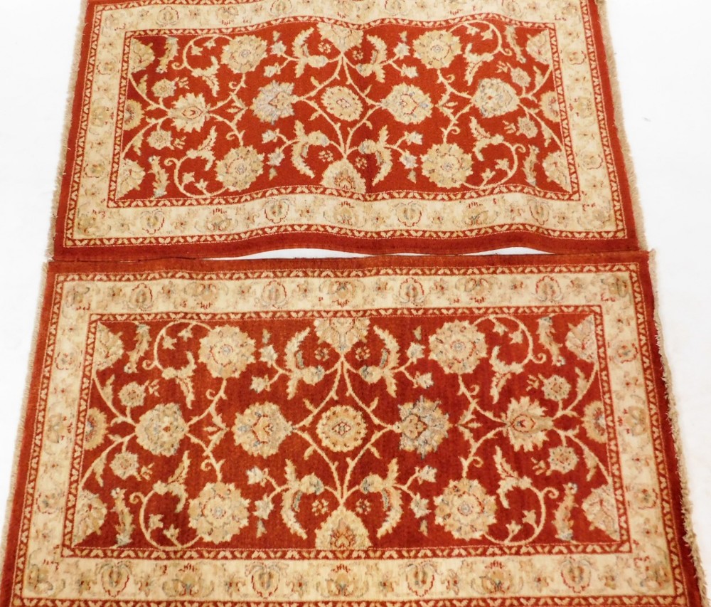 Two Kabir Goby rugs, retailed by John Lewis in an orange and cream bordering, machine woven, 155cm x