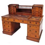 A Victorian mahogany banker's desk, with Wellington action upper drawers and gallery, lift flap cent