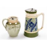 Two Art Nouveau style pottery items, to include a McIntyre Burslam milk jug, on a green ground, with