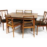 A retro teak dining suite, comprising extending dining table and six associated chairs, two carvers,