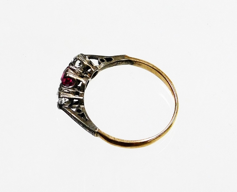 A Victorian three stone dress ring, set with garnet and two imitation diamonds, in a silver setting - Image 2 of 2
