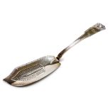 A George IV silver fish slice, with shell fiddle pattern handle and with pierced and part gadrooned