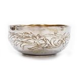 An Edwardian Art Nouveau silver bowl, with repoussé decoration of flowers and leaves, Chester 1905,