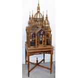A bird cage model of the Taj Mahal, on a wooden base, the model figure 110cm high, with additional t