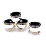 A set of four Victorian plain silver salts, on orb feet, with blue glass liners, London 1890, 6cm di