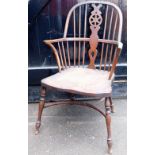 A wheel back Windsor chair, with crinoline stretcher.