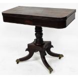 An early 19thC flame mahogany card table, the top with canted corners and banded panels, on a balust