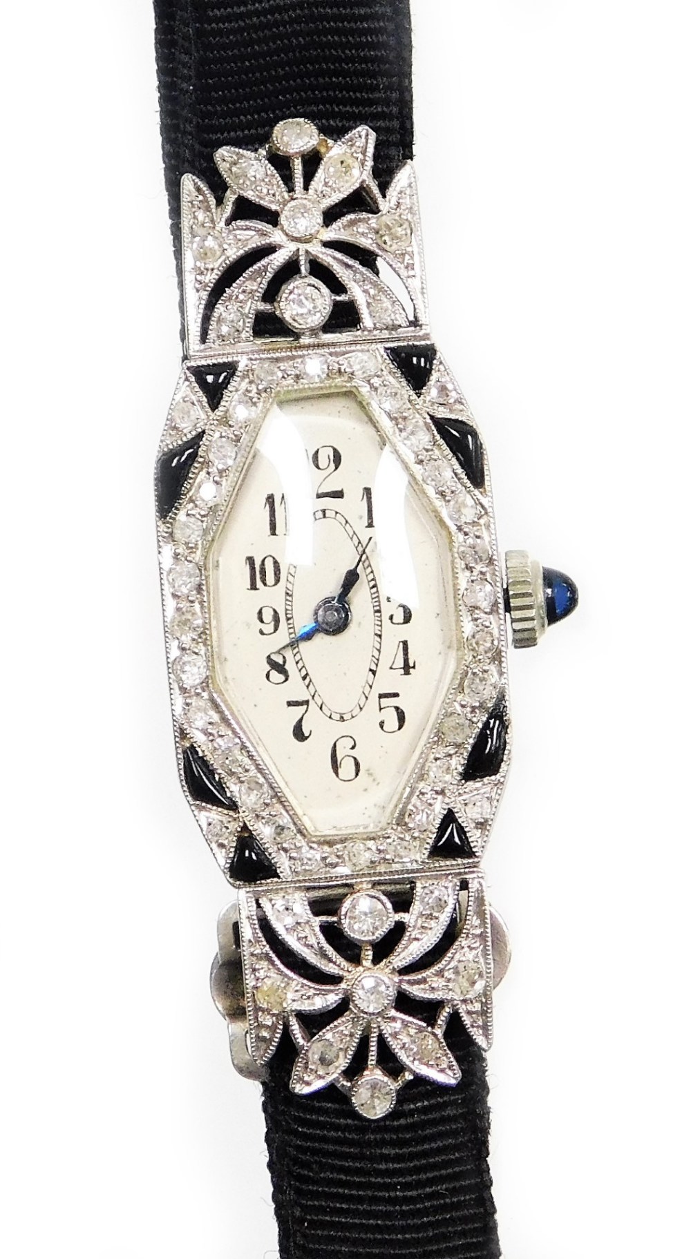 An early 20thC diamond set ladies cocktail watch, with a hexagonal shaped dial, in a white enamel fi