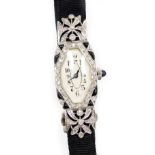 An early 20thC diamond set ladies cocktail watch, with a hexagonal shaped dial, in a white enamel fi