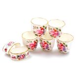 A set of five Royal Crown Derby miniature bowls, in the Derby Posies pattern, with two matching napk