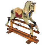 A vintage Victorian style child's rocking horse, with pine frame and sectional horse with realistic