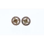 A pair of 18ct white gold diamond halo studs, the diamonds totalling approximately 0.69cts, together
