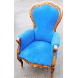 An Oakland bedroom chair, upholstered in blue velvet material, with button back on splayed legs, 120