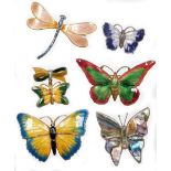 A group of enamelled brooches, to include a small purple butterfly brooch, white metal, stamped ster