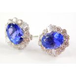 A pair of 18ct white gold tanzanite and diamond cluster earrings, the oval tanzanite totalling appro