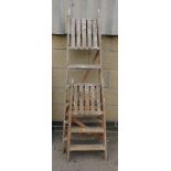 Two wooden step ladders.